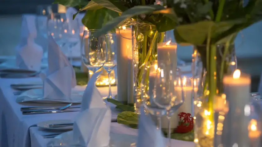 Elegantly set table with lit candles